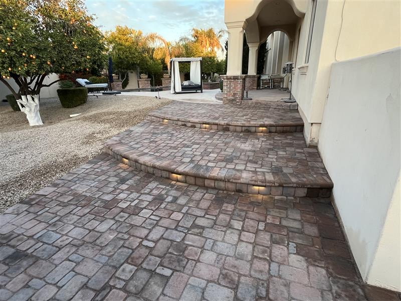 Patterned pavers and sweeping curved steps crafted by Phil