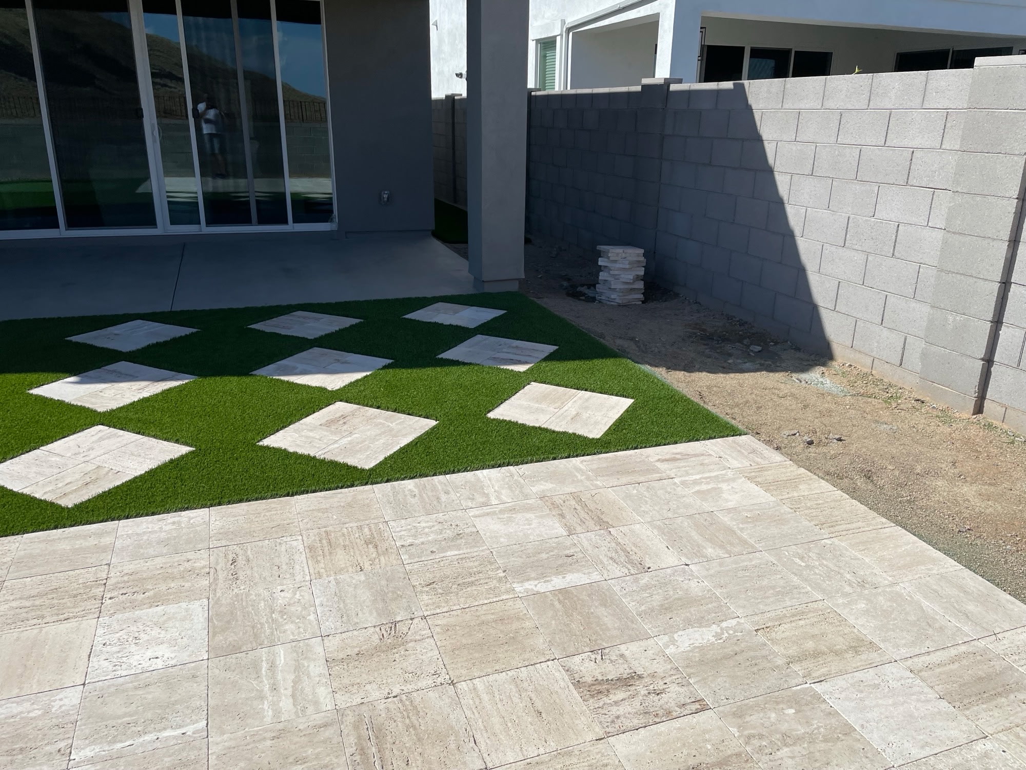 Geometric pavers and turf improving curb appeal