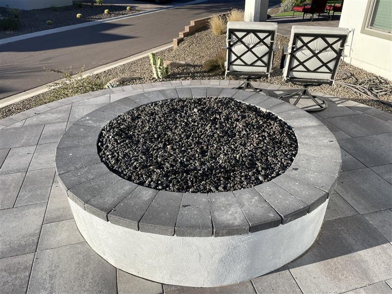 Circular outdoor fire feature and paver patio